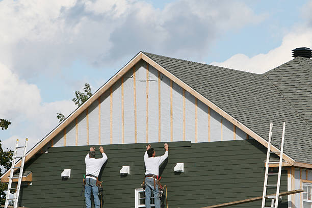 Professional Storm Damage Siding Repair technician working in Callao, VA